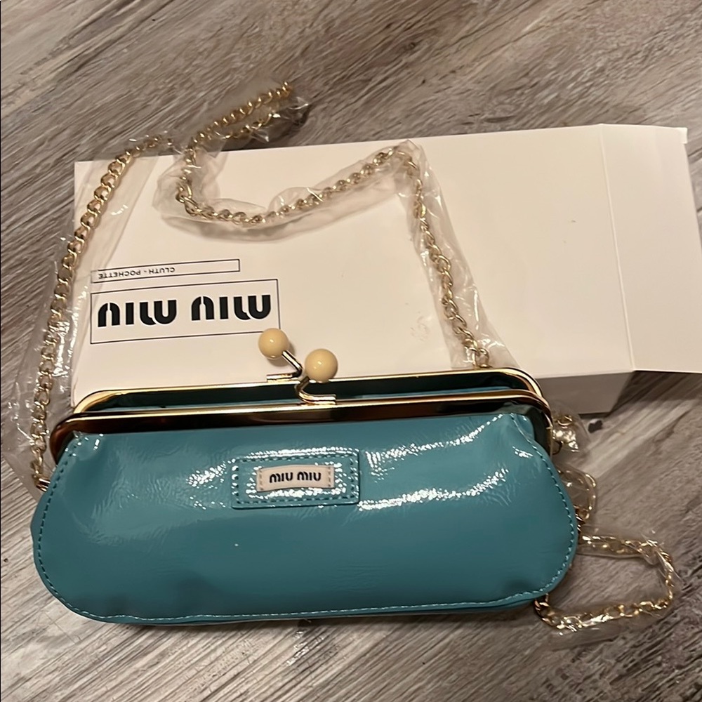 Miu Miu Blue leather Clutch with Gold Accents